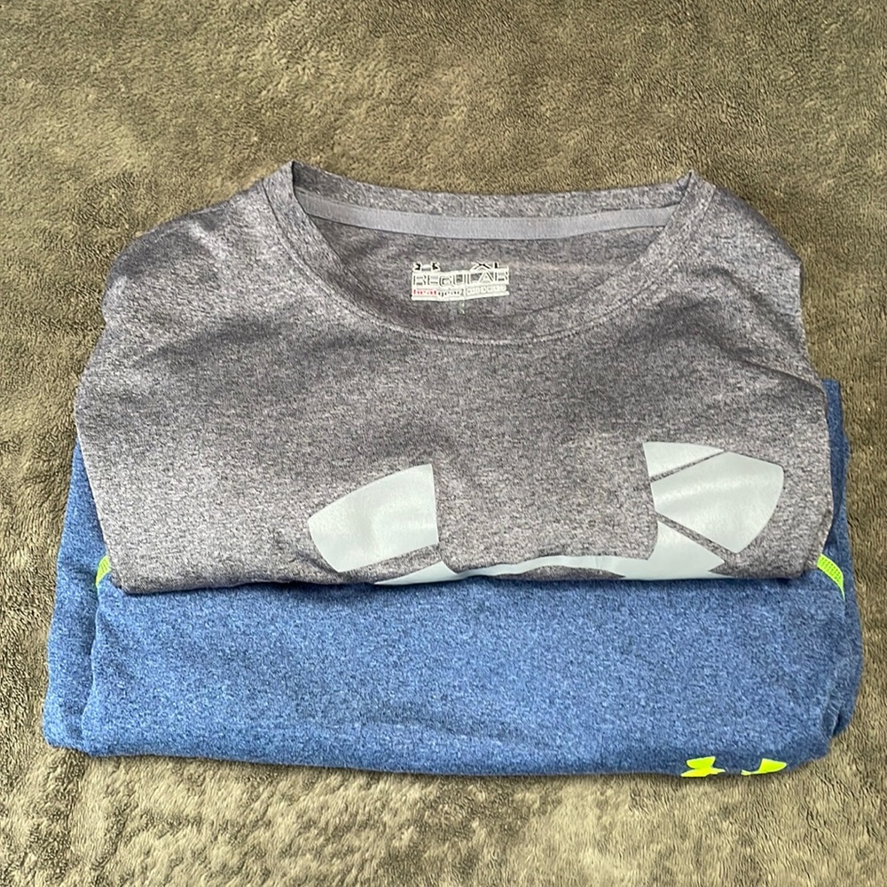 Two Under Armour short sleeve athletic  shirts.